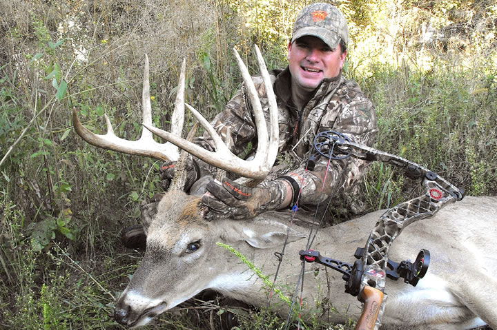 The author Jason Mitchell with an archery buck from 2014 harvested in early September.  When the terrain permits, rely more on what you can learn from a spotting scope versus relying solely on trail cameras.