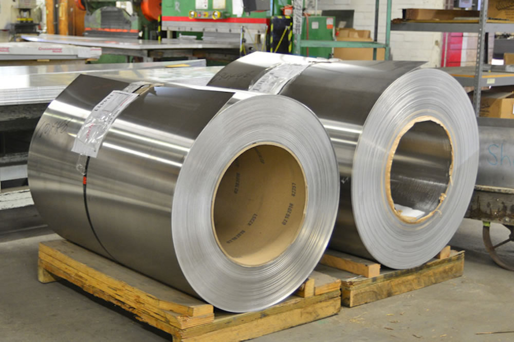 Aluminum rolls waiting to be decoiled and formed into parts.